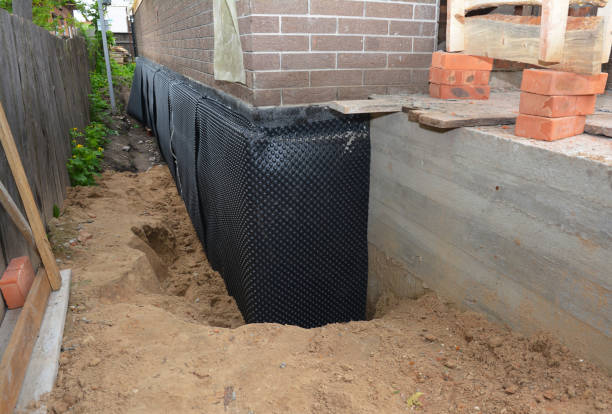 Happy homeowners after waterproofing job in Cement City